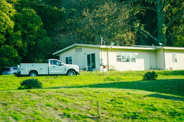 White service truck parked at a residential home